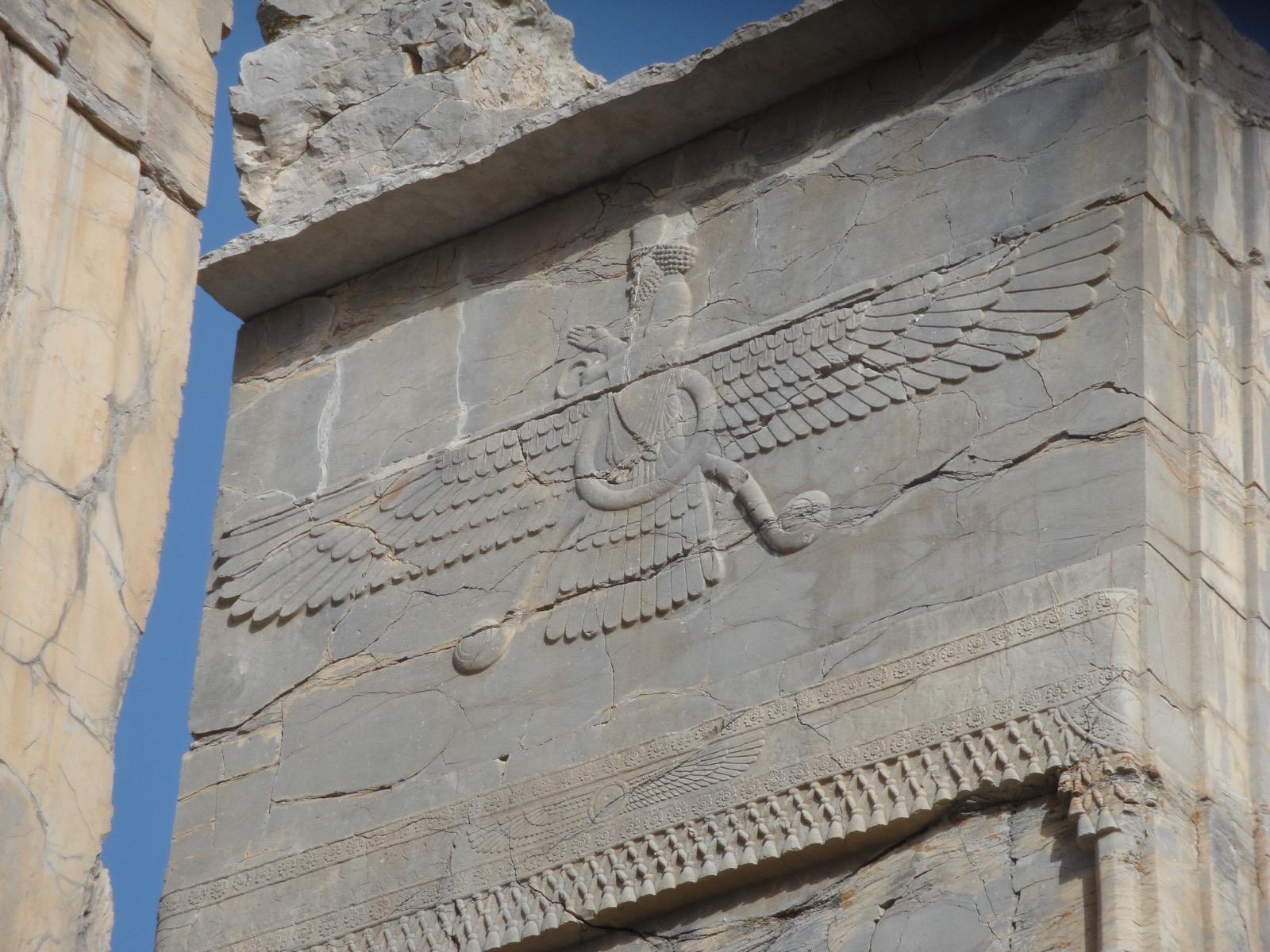 Stone Faravahar relief carved at Persepolis in Iran